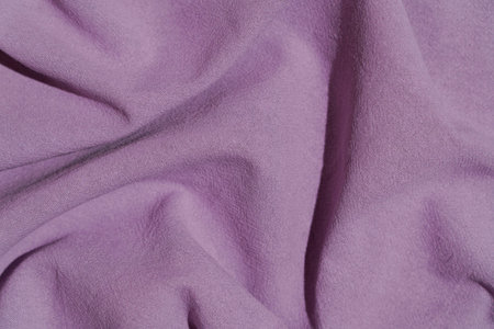 Fabric cotton background. Folds, texture and draperies on the surface textile of garment warp, upholstery and designの写真素材