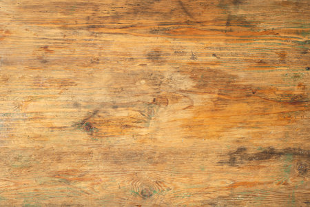 Old wooden table background. Rustic wood surface with texture and stains. Copy space.