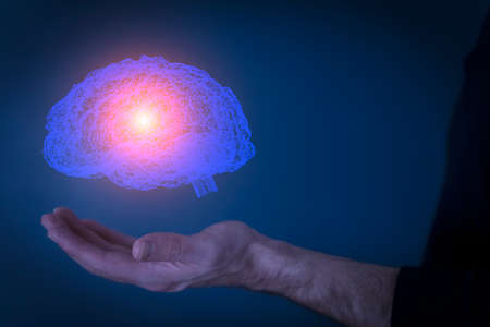 Brain hologram. Virtual 3D digital hologram of brain in the hands of a human scientist or user. Augmented reality, diagnostic technology, science of the future concept.の写真素材