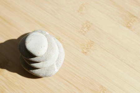Zen stones background. Sea stones on a bamboo surface. Selected focus. Relaxation, harmony,...