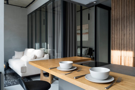 Interior of the house kitchen and living room with modern luxury design and furniture. Modern room with trendy architectureの写真素材