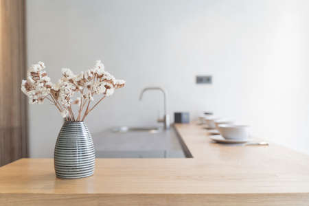Home kitchen interior background. Counter wooden kitchen table with decor and modern design.の写真素材