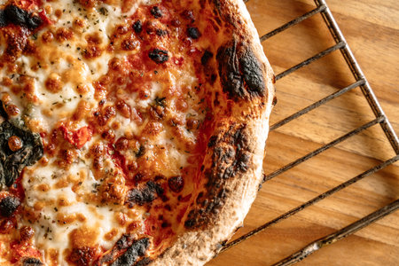 Pizza food background. Homemade Neapolitan pizza Margherita with mozzarella cheese and tomato sauce...