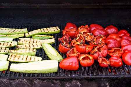 Grilled barbecue vegetables. Summer vegetables peppers and zucchini are roasted and cooked outside...