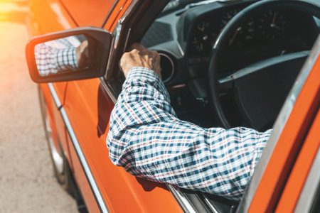 Driver travels in the summer in a vintage car. Lifestyle, vintage, vacation, road trip concept.