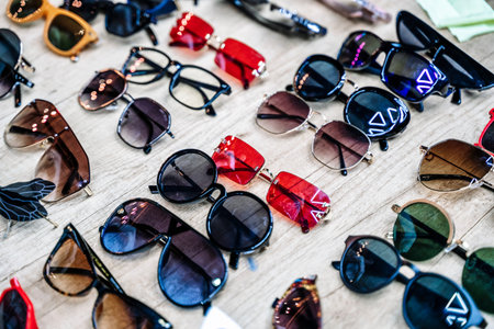 Vintage sunglasses on the counter of a flea market. Retro, fashion, vintage concept.
