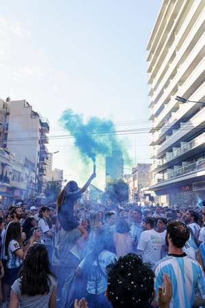 Buenos Aires, Argentina - December 14, 2022: Happy Argentine football fans celebrate winning a football match at theのeditorial素材