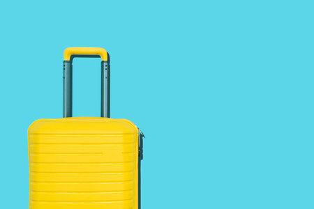 Colored suitcases on background background. Travel, vacation, trip minimal concept.の写真素材