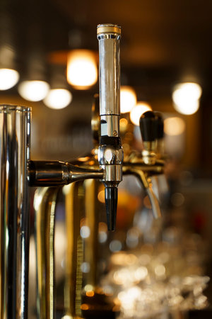 Beer pub bar. Beer taps with beer in a restaurant. High quality photo