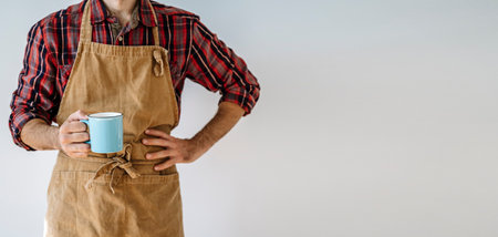 Business owner worker in apron on blank white banner background. Private business concept.の写真素材