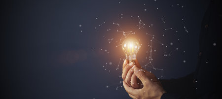 Knowledge idea bulb concept. Electric light bulb in hand business manager. Innovation, brain, creative conceptの写真素材