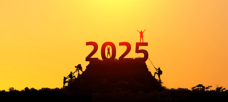2025 year concept. Silhouettes of active people in nature against the backdrop of sunset and the numbers 2025の写真素材