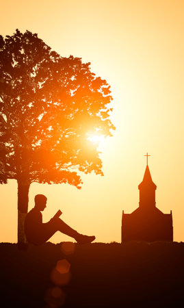 Reading the Bible at Sunset at a Christian Church. Studying the Bible and Christianity Conceptの写真素材