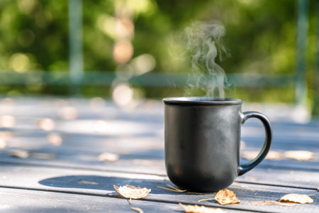 Cup of hot drink on nature background. Morning in the forest in nature with a hot drinkの写真素材