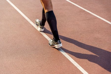 Sports runners on the running track. Sport, stadium concept.の写真素材