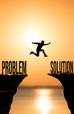 Solution and problem concept. Man jumping from problem to solution in businessの写真素材