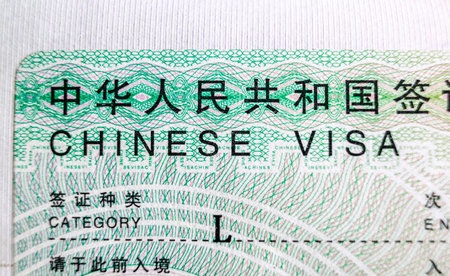 Chinese visa in foreign passport for tourism and travel in Chinaの写真素材