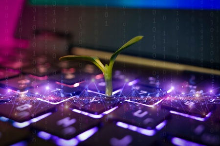 Computer keyboard with a small green plant sprouting. Technologies, ecosystem, concept developmentの写真素材