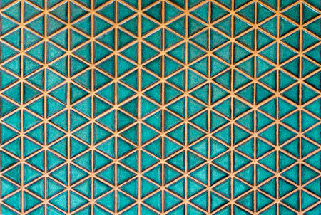 Green ceramic tile background. Old vintage ceramic tiles in green to decorate the kitchen or bathroomの写真素材