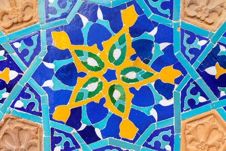 Old tiles background. Vintage colored ceramics with a pattern on the facadeの写真素材