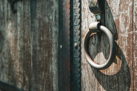 Old barn wooden door with iron ring. Lock door backgroundの写真素材