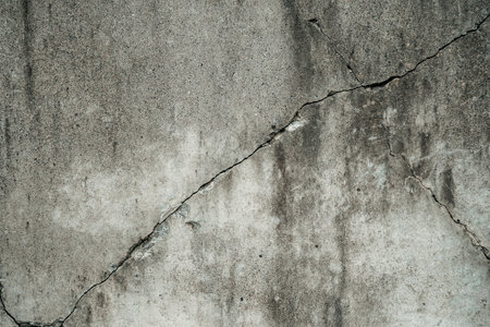Concrete crack texture background texture. Grey crack wallの写真素材