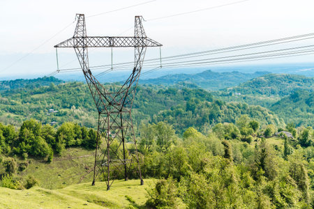 Power Lines Crossing Mountain Landscape in Georgiaの写真素材