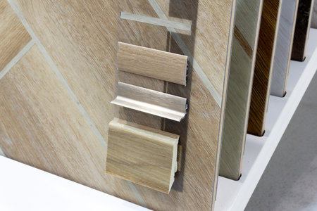 Laminate background. Samples of laminate or parquet with a pattern and wood texture for flooring and interior design. Production of wooden floors..の写真素材