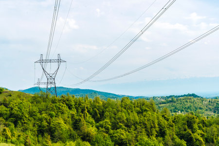 Power Lines Crossing Mountain Landscape in Georgiaの写真素材