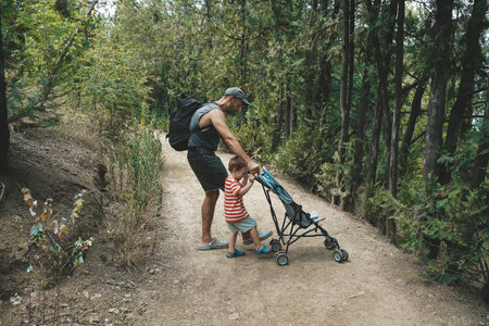 Father and Toddler Spending Time in Summer Forest