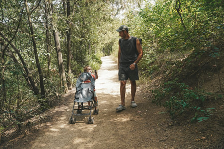 Father and Toddler Spending Time in Summer Forest