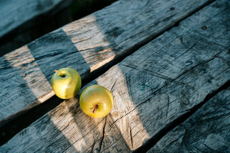 Green Apples on Rustic Wooden Table. Country Style and Natural Designの写真素材