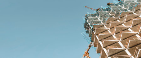 Construction of a building banner background. Construction site with crane. Business, development,...