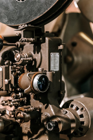 Vintage Industrial Film Projector Machine with Lens and Metal Body