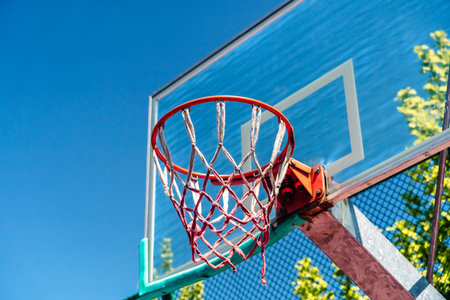 Outdoor Basketball Hoop Against Blue Sky