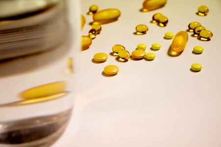 Many pills and tablets isolated on white backgroundの写真素材