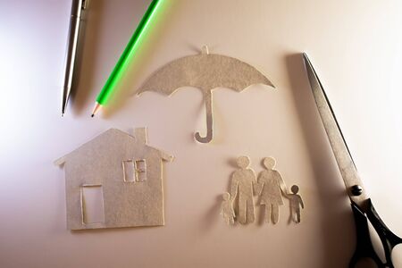 Concept of safe happy family cut out of paper.の写真素材