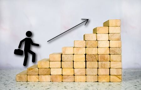 Hand arranging wood block stacking as step stair. Ladder career path concept for business growth success process, Copy spaceの写真素材