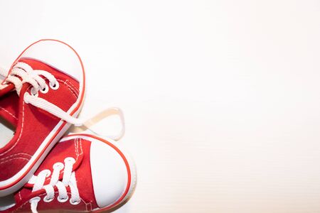 Red sneakers top view close up isolated on white backgroundの写真素材
