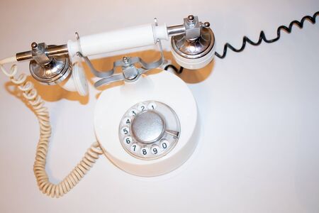 Vintage old telephone with binoculars conceptual still lifeの写真素材