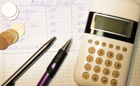 Flat lay, top view office table desk. Workspace with calculator, black pen , laptop on the indigo blue background.Copy Space for text,Empty Blank to word.Business Finance,Education Technology Concept.の写真素材