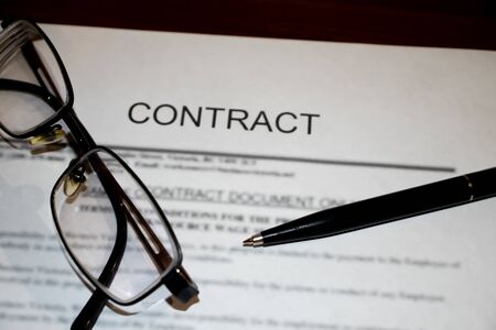 Legal contract signing - buy sell real estate contractの写真素材