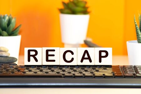 Recap word from wooden blocks on deskの写真素材