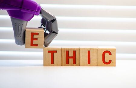 Wooden blocks with the word Ethic. Defending, systematizing and recommending concepts of right and wrong conduct. Moral philosophyの写真素材