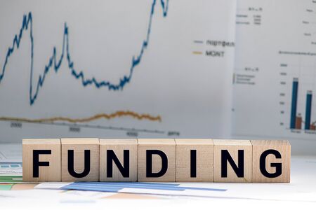FUNDING word written on wood block, business conceptの写真素材