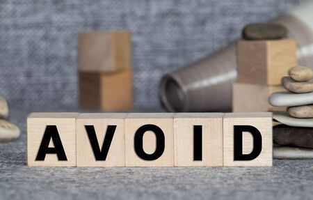 Wooden Blocks with the text Avoid, business conceptの写真素材