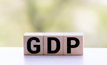GDP, Gross Domestic Product concept, cube wooden block with alphabet combine abbreviation GDP, measure growth of country economic product and service.の写真素材