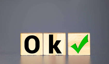Word ok made of wooden cubes on a white backgroundの写真素材