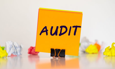 Torn paper with word Audit, business concept