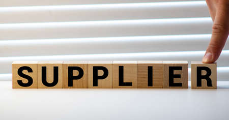 SUPPLIER word made with building blocks, conceptの写真素材